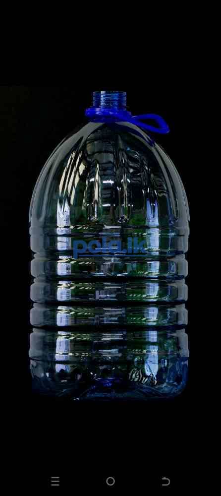 Bottled water and empty bottle - photo 4