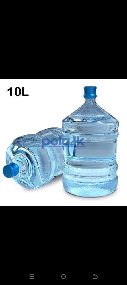 Bottled water and empty bottle - photo 1