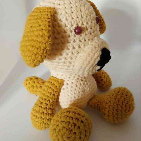 Amigurumi stuffed crocheted puppy